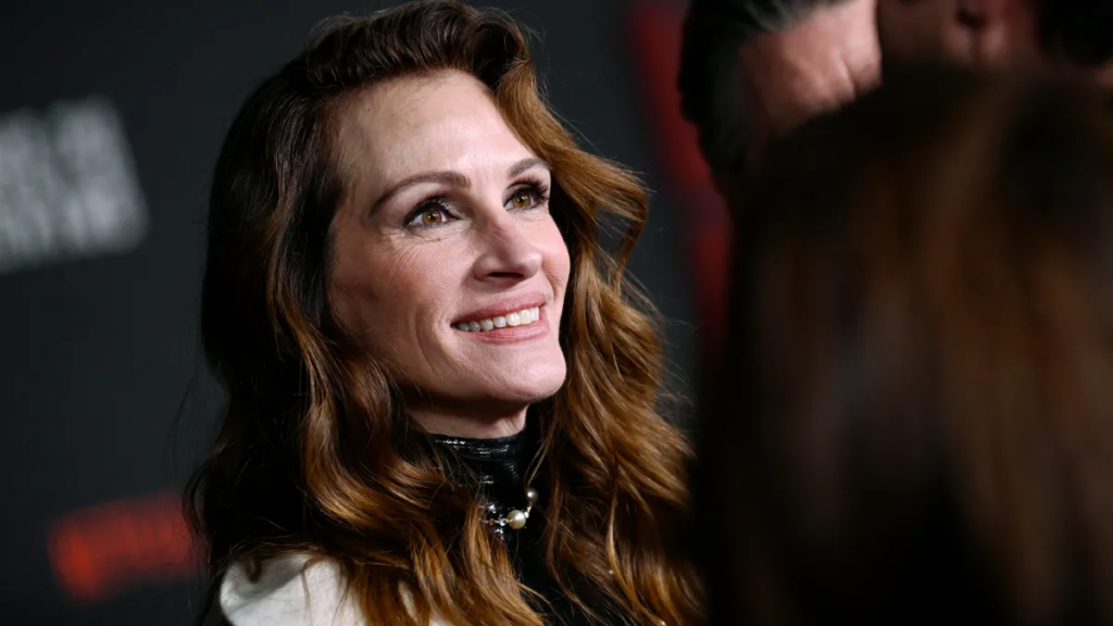 Julia Roberts, the iconic actress, pictured on the red carpet, symbolizing the financial success and career achievements discussed in the blog about her net worth.