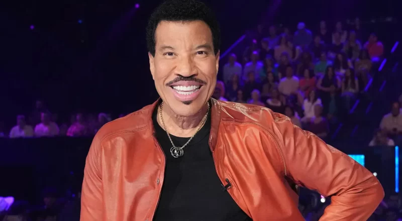 Lionel Richie, the musical maestro, is captured in a moment of passion, symbolizing his enduring success and financial achievements.