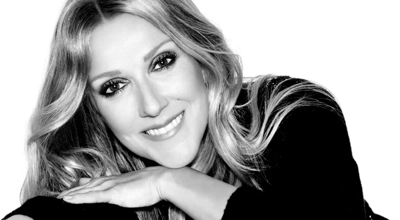 Celine Dion, the iconic singer, performs on stage, symbolizing her immense success and financial achievements discussed in the blog about her net worth
